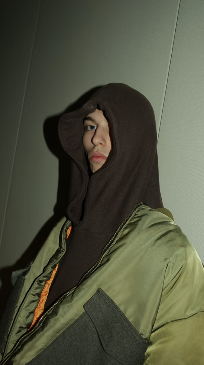 Hood portrait in olive bomber