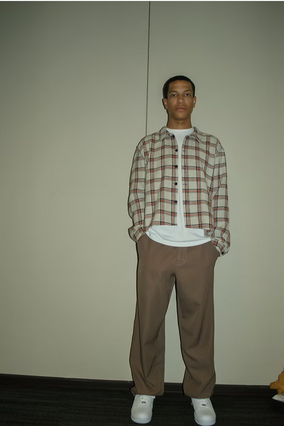Model in plaid overshirt, full length